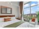 The main bedroom has large windows, a sitting area, and plenty of natural light at 905 Juniper Ne St # 808, Atlanta, GA 30309