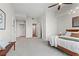 Spacious main bedroom featuring a ceiling fan, hardwood bed frame, and access to a large walk-in closet at 905 Juniper Ne St # 808, Atlanta, GA 30309