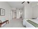 This is a large main bedroom with neutral paint, an accent bench, and access to two closets and an ensuite bathroom at 905 Juniper Ne St # 808, Atlanta, GA 30309