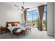 Main bedroom with large windows, ceiling fan, and neutral decor at 905 Juniper Ne St # 808, Atlanta, GA 30309