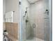 Shower with tiled walls, rainfall shower head, and glass door at 905 Juniper Ne St # 808, Atlanta, GA 30309
