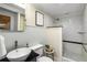 Elegant bathroom featuring a vessel sink, subway tile shower, and classic black and white tile flooring at 130 26Th Nw St # 415, Atlanta, GA 30309