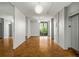 Hallway featuring wood floors, large windows, and elevator access, providing a welcoming entry at 130 26Th Nw St # 415, Atlanta, GA 30309