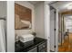 Hallway featuring clean lines, modern artwork, and access to the bathroom and other living spaces at 130 26Th Nw St # 415, Atlanta, GA 30309