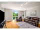 Comfortable living room with large windows, built-in shelving, and attractive flooring at 130 26Th Nw St # 415, Atlanta, GA 30309