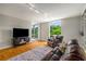 Living room with natural light, parquet floors, and open access to balcony at 130 26Th Nw St # 415, Atlanta, GA 30309