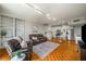 Inviting living room with hardwood floors, open to the kitchen, and features a brown leather sofa at 130 26Th Nw St # 415, Atlanta, GA 30309