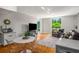 Open concept living room with access to balcony overlooking tree canopy at 130 26Th Nw St # 415, Atlanta, GA 30309