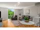 Comfortable living room with parquet floors, a leather sofa and a view at 130 26Th Nw St # 415, Atlanta, GA 30309