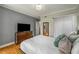 Relaxing main bedroom showcasing a comfortable bed, hardwood floors, and ample natural light at 130 26Th Nw St # 415, Atlanta, GA 30309