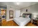 Comfortable bedroom with hardwood floors, a modern bed frame, and convenient access to the laundry area at 130 26Th Nw St # 415, Atlanta, GA 30309