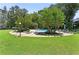 Community pool surrounded by mature trees and plenty of lounge seating at 130 26Th Nw St # 415, Atlanta, GA 30309