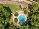 Aerial view of community pool surrounded by shade trees and green space at 130 26Th Nw St # 415, Atlanta, GA 30309