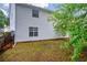 Backyard view showcasing the home's exterior with partial view of the yard at 1645 Cobbs Creek Ln, Decatur, GA 30032