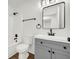 Bathroom featuring a gray vanity, new fixtures, and shower-tub combo at 1645 Cobbs Creek Ln, Decatur, GA 30032