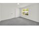 Bedroom with neutral carpet, double windows and a closet at 1645 Cobbs Creek Ln, Decatur, GA 30032
