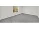 Bright bedroom with new carpeting and natural light from a large window at 1645 Cobbs Creek Ln, Decatur, GA 30032
