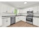 Modern kitchen with white cabinets, granite countertops, stainless steel appliances, and a window view at 1645 Cobbs Creek Ln, Decatur, GA 30032