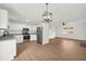 Open kitchen and living room area with stainless steel appliances, granite countertops and wood floors at 1645 Cobbs Creek Ln, Decatur, GA 30032