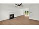 Spacious living room with a fireplace, wood-look flooring, and a view to the back yard at 1645 Cobbs Creek Ln, Decatur, GA 30032