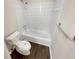 Bright bathroom featuring a tub with white tiled walls and a wood-look floor at 1805 Ashborough Se Cir # H, Marietta, GA 30067