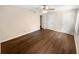 Bedroom showcasing hardwood floors, natural light, ceiling fan, and closet space at 1805 Ashborough Se Cir # H, Marietta, GA 30067