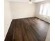 Bedroom showcasing a ceiling fan, large window, hardwood floors, and ample natural light at 1805 Ashborough Se Cir # H, Marietta, GA 30067