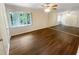 Spacious bedroom with hardwood floors, large window and closet featuring mirrored doors at 1805 Ashborough Se Cir # H, Marietta, GA 30067