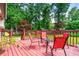 Enjoy outdoor living on this spacious wood deck with outdoor furniture and lush surroundings at 273 Hardwood Ln, Lawrenceville, GA 30044