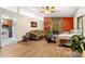 Cozy living room features a stone fireplace, hardwood floors and neutral-toned furniture at 273 Hardwood Ln, Lawrenceville, GA 30044