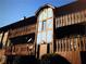 A condo with upper and lower balconies and brown wood railings at 401 Camelot Dr, Atlanta, GA 30349