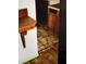 A damaged room with old, stained floor tiles and damage to the floor at 401 Camelot Dr, Atlanta, GA 30349