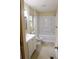 Bright bathroom features a shower over tub combo, a single sink vanity and a window at 618 Old Doss Dr, Canton, GA 30115