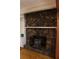 Living room fireplace with stone surround and rustic details at 618 Old Doss Dr, Canton, GA 30115