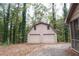 Two-car detached garage offering additional storage and convenient access from the home at 618 Old Doss Dr, Canton, GA 30115