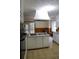 White kitchen island with range-top, oven and cabinets with backyard view at 618 Old Doss Dr, Canton, GA 30115
