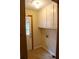 Mud room with door to outdoors and an overhead cabinet for added storage at 618 Old Doss Dr, Canton, GA 30115