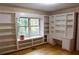Office space features built-in desk space, shelving and hardwood floors and outside views at 618 Old Doss Dr, Canton, GA 30115