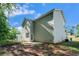 The rear exterior of the home offers a concrete slab and nice lawn at 741 Jackson Ct, Social Circle, GA 30025
