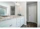 Bright bathroom featuring dual sinks, granite countertops, and modern fixtures at 741 Jackson Ct, Social Circle, GA 30025