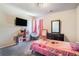 Bright bedroom with a television, mirror, and fun play area at 741 Jackson Ct, Social Circle, GA 30025