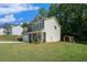 Spacious yard with a swing set, perfect for outdoor play and relaxation, complementing the charming two-story home at 741 Jackson Ct, Social Circle, GA 30025