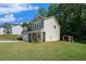 View of home's side exterior with a spacious lawn and a playset at 741 Jackson Ct, Social Circle, GA 30025