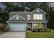 Charming home exterior with gray siding, inviting front porch at 741 Jackson Ct, Social Circle, GA 30025