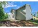 Back exterior of home with a concrete patio and green siding at 741 Jackson Ct, Social Circle, GA 30025