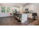 Bright modern kitchen featuring stainless steel appliances, granite countertops, and a breakfast bar at 741 Jackson Ct, Social Circle, GA 30025