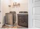 Modern laundry room with stainless steel washer and dryer at 741 Jackson Ct, Social Circle, GA 30025