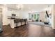 Open-concept living space featuring modern decor, including a gourmet island, and plush seating at 741 Jackson Ct, Social Circle, GA 30025