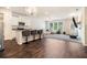 Modern living space with a kitchen featuring an island with bar seating and stainless steel appliances at 741 Jackson Ct, Social Circle, GA 30025