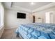 This main bedroom includes a television, a large window, and a closet at 741 Jackson Ct, Social Circle, GA 30025